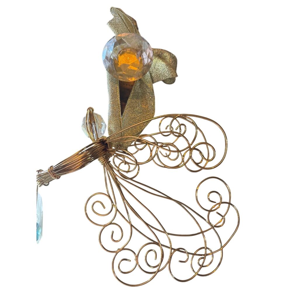gold wire angel ornament resembles vintage Avon Radiant Angel